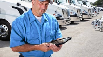 A fleet management using a fleet management system to manage a big fleet of big trucks