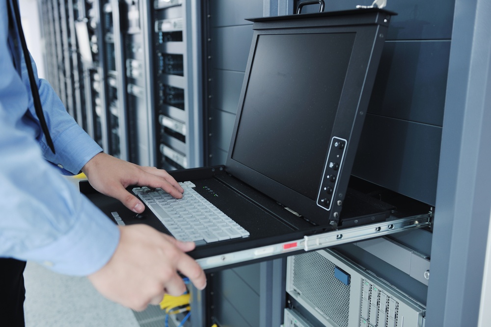 young handsome business man  engineer in datacenter server room