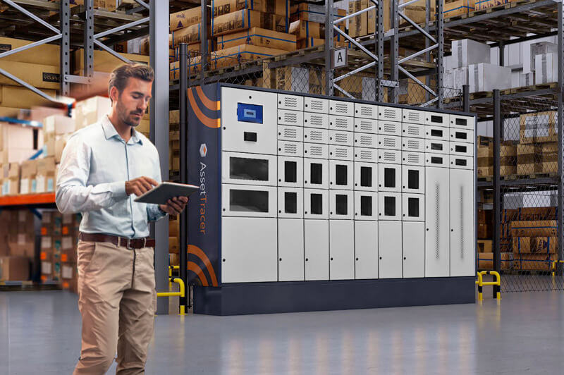 A warehouse employee standing with a tablet in his hands