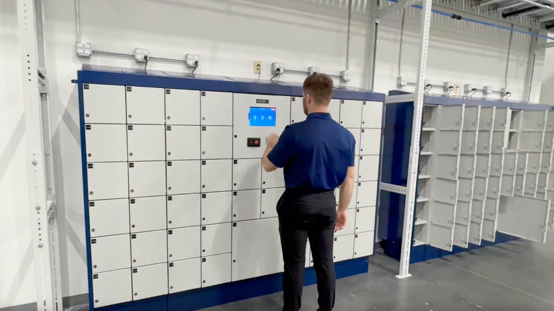 An employee using a smart locker to retrieve an asset